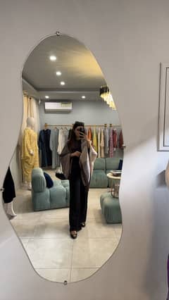 Asymmetrical wall mirror
