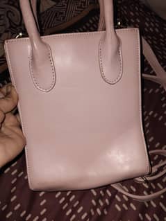 T pink purse with good condition and with mini purse