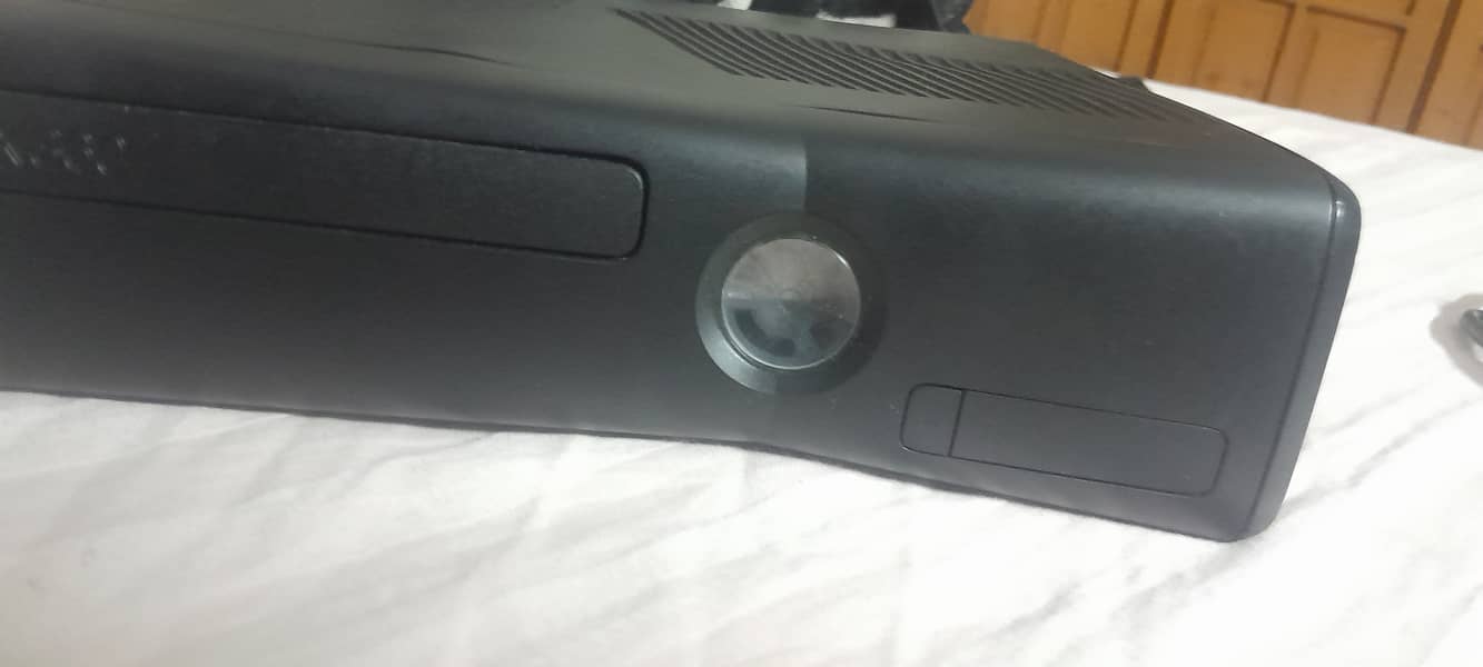 Xbox 360 with one wireless controller. New Condition less than  month 2