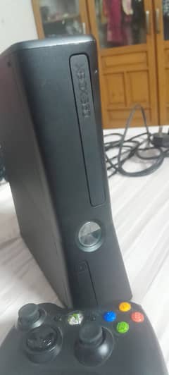 Xbox 360 with one wireless controller. Good condition 2 months used
