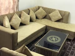8 seater Lshape sofa with table is up for sale