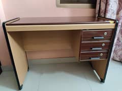 wooden study table with storage drawers