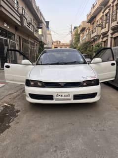 I am selling mistubishi lancer car discription read kar ka msg karein.