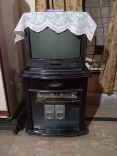 A television with the DVD player and speakers