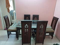 wooden dining table and chairs