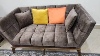 7 seater sofa set with center table and 2 side tables .