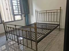 Wrought iron bed with dresser and mirror