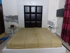 double bed with side table and devider