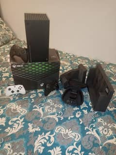 Xbox series x with Xbox elite series two controller and 2 controllers