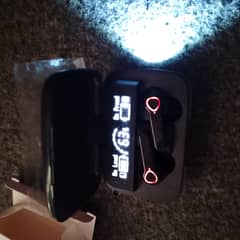 brand new earbuds with a light and a mini power bank