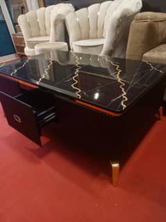 Elegant and stylish black center table with modern marble