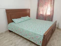 Bed with side drawers and dressing table