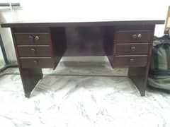 office table and 1 revolving chair. .