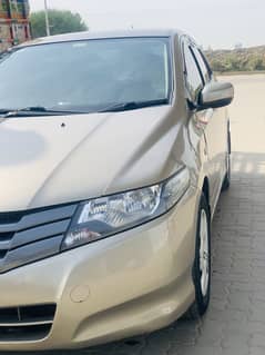 Honda city 2013 model lahore registered gold colour