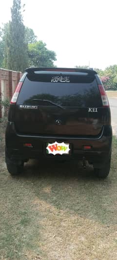 Black Suzuki Kei Hatchback with Custom Decals