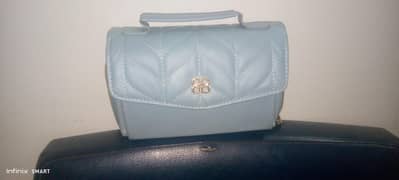new blue bag with  great design good stuff  3 pockets