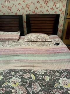 2 single beds without mattress urgent sale negotiable