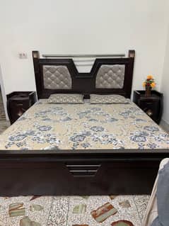 king sized bed with mattress and dressing table