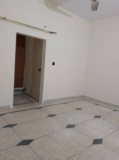 2 bed lounge flate for rent tiled washrooms American kitchen good location 24 hours water and electricity boundary wall project