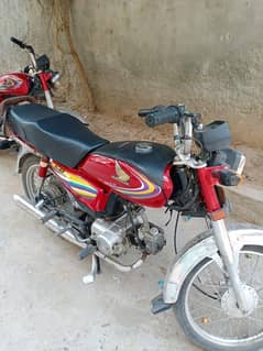 Honda CD 70 Model 2013 Red color.