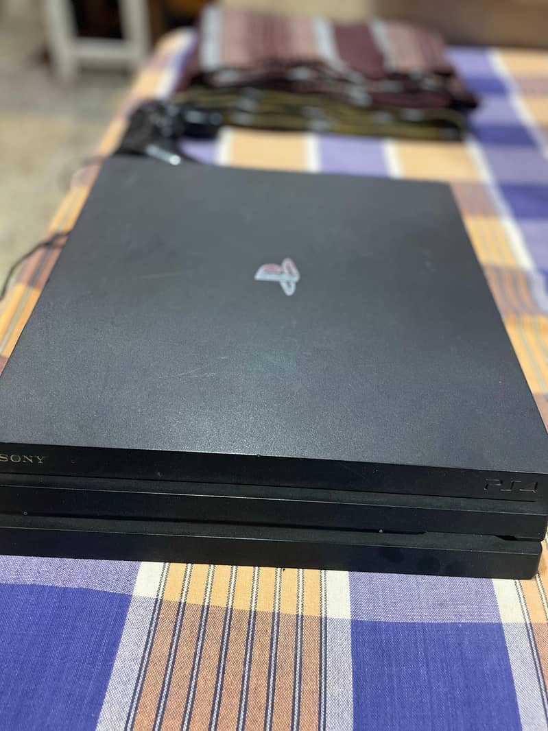 Ps4 pro 1 tb  with controller and all famous title in account 2