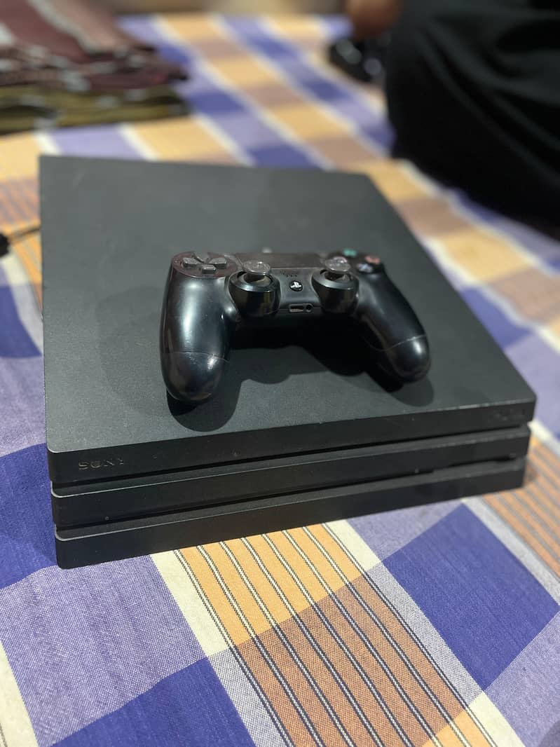 Ps4 pro 1 tb  with controller and all famous title in account 5