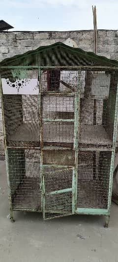 Iron cage 2 portion 5ft hight 35inch width 23 inch deep in good condit