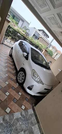 white Toyota aqua