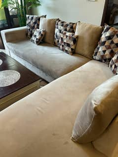 L-Shaped 7-Seater Sofa with Wooden Center Table and Rug