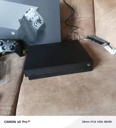 xbox one x with 2 games