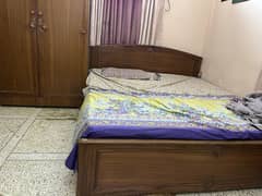 Double size bed with 2 door cupboard