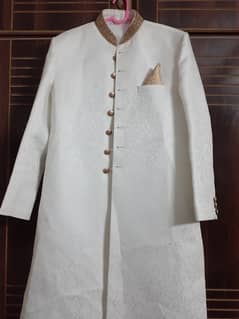 White sherwani maroon kullah cream khussa and waist coat