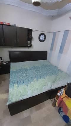 pair of single beds with mattresses