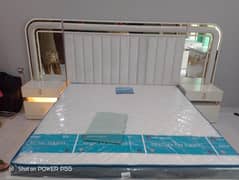 bed with sidetables and dressing