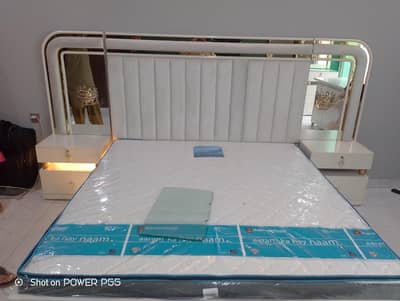 bed with sidetables and dressing