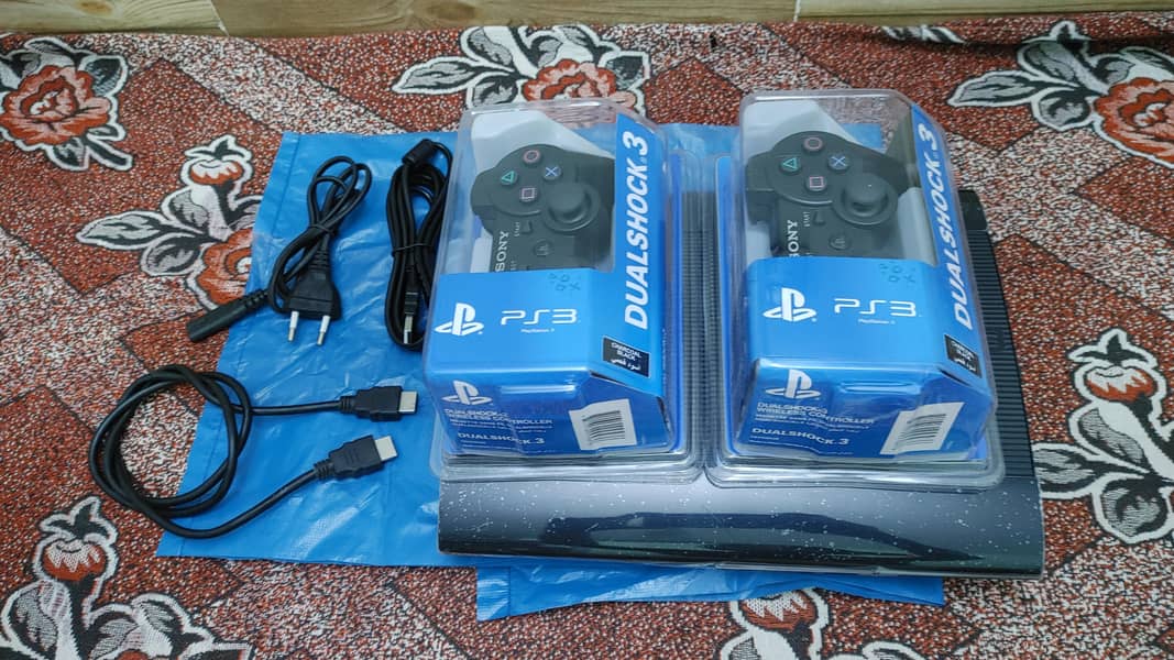 super  slim ps3 500gb/48 games installed 2 remotes wireless 1