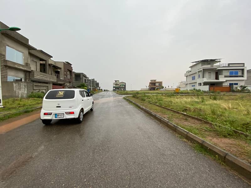 PRIME PLOT IN BLOCK L 10 MARLA FULL HEIGHTED AND SOLID INFRONT OF MASJID AND COMMERCIAL 5