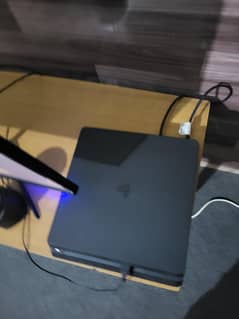 ps4 slim with games and controllers complete.