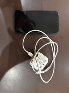 iPhone 12 with complete charger