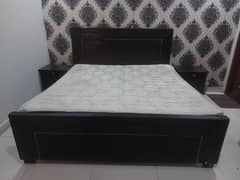 king size wooden bed with side tables and 8 inch spring mattress