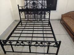 iron queen bed used in condition