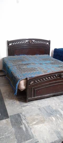 Double bed with spring mattress