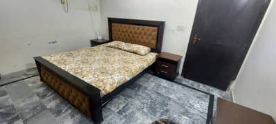 Double bed with two side tables and dressing table