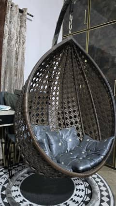 chair swing  with  rug and  pillows