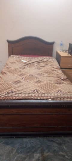 wooden single bed with 1 side table