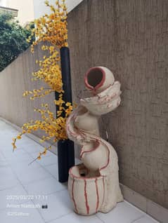 water fountain + plant