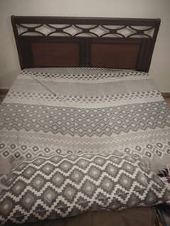 bed with mattress and dressing table