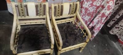 2 wooden chairs one table with dico paint