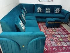 Stylish Teal Sofa Set with Decorative Rug