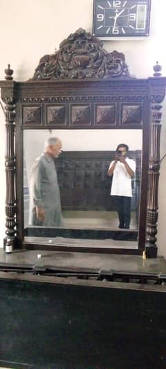 king-size wooden bed and dressing